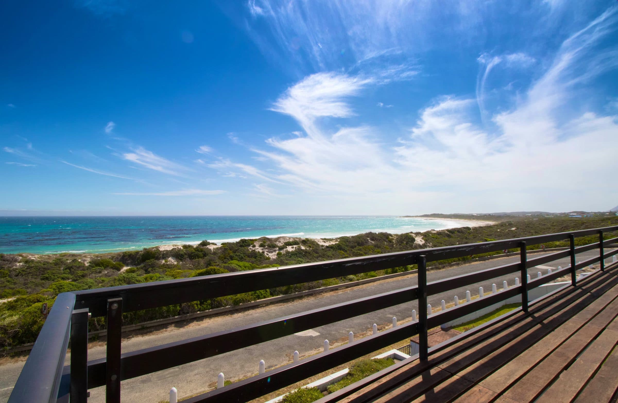 Storkereden: Sweeping turquoise beach and ocean from deck rail